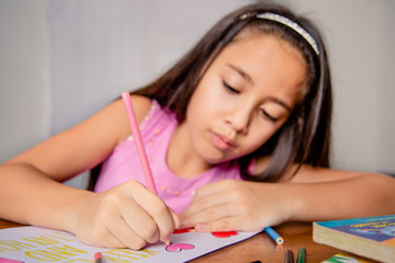 girl drawing slogan stay home