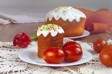 Easter cake and painted eggs on a table. Traditional orthodox christian easter food. Side view.