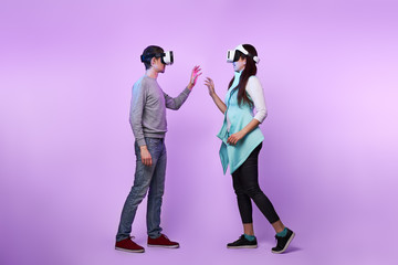 Fototapeta premium Couple in love communicate using a virtual reality headset.