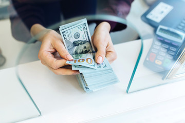Woman counting money banknotes.Concept photo of money, banking ,currency and foreign exchange rates.