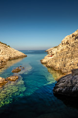 Fototapeta na wymiar Crystal clear water at Korakonissi on a summer morning