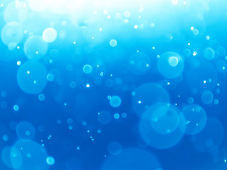 White bokeh on a blue background .Blue  bokeh background. Blur background. White bubbles.