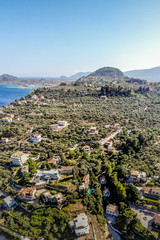 Incredible view towards the Zakynthos town and Bochali viewpoint with houses and olive groves in the foreground