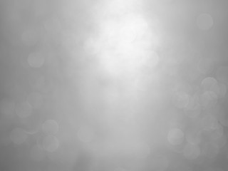 White and gray  bokeh background.Abstract blur background. White bubbles on a black background.