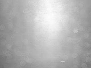 White and gray  bokeh background.Abstract blur background. White bubbles on a black background.