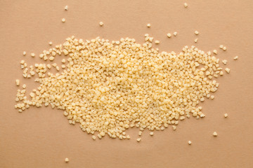 Couscous On A Brown Background. for vegetarians, grocery, health food stores, breadboard model for...