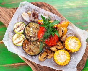 Grilled vegetables: corn, tomato, eggplant, zucchini, pepper and mushrooms. Vegetarian dish.