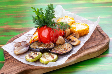 Grilled vegetables: corn, tomato, eggplant, zucchini, pepper and mushrooms. Vegetarian dish.