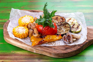 Grilled vegetables: corn, tomato, eggplant, zucchini, pepper and mushrooms. Vegetarian dish.
