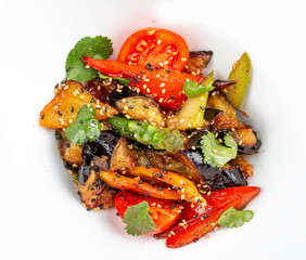 Eggplant Tempura with vegetables in Unagi sauce. Vegetarian dish.