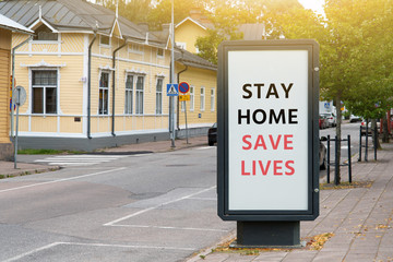 Street banner with the inscription "Stay home save lives". Quarantine self-isolation