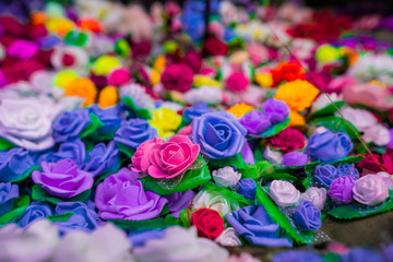 Fototapeta na wymiar Different colors of roses in a basket