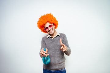 guy in a wig with a cleaner for windows