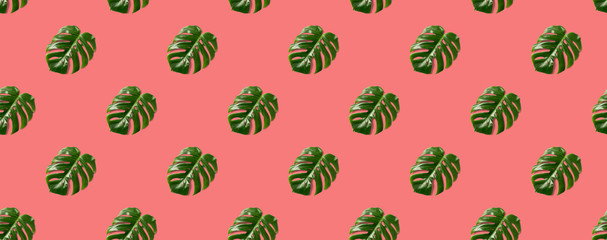 Tropical leaves seamless pattern on pink background