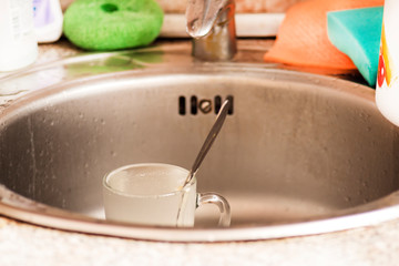 Washing dirty glasses with detergent water