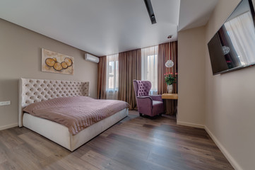 Interior of the apartment in a contemporary style. Bedroom