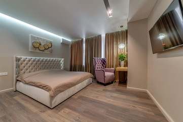 Interior of the apartment in a contemporary style. Bedroom