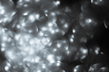 Shimmering blur spot light on silver color background, Christmas concept