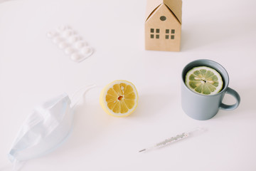 Seasonal allergic rhinitis or flu. Protective mask, pills, thermometer. Healthcare concept. Coronavirus COVID-19 background