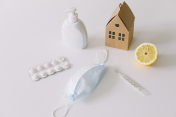 Tools for preventing the spread of virus. Protective mask, vitamins, pills, mercury thermometer. Coronavirus COVID-19 background