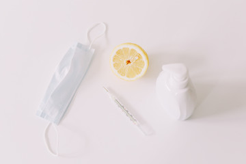 Seasonal allergic rhinitis or flu. Protective mask, pills, thermometer. Healthcare concept. Coronavirus COVID-19 background