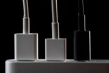 Power Bank with USB wires on a black background