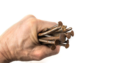 Used crooked rusty nailes on a white. Perseverance and strength