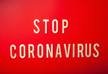 stop coronavirus word text wooden letter on red background corona virus covid-19