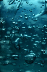 Futuristic looks background of the bubbles in blue light