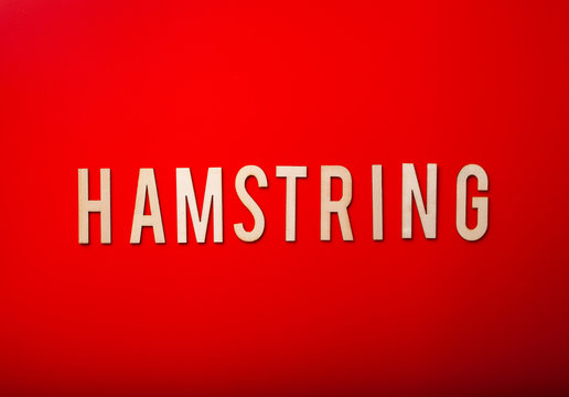 hamstring norwegian word text wooden letter on red background coronavirus covid-19