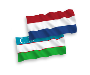 Flags of Uzbekistan and Netherlands on a white background