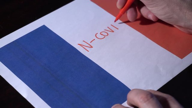 Europe, France, Paris - flag of France and write n-cov19  during  Coronavirus outbreak