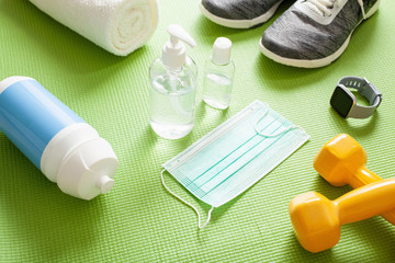 protective medical mask sanitizer gel gloves. home fitness training sneakers dumbbell and protective measures against virus, bacteria