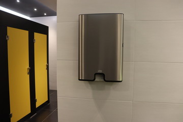 hands dryer and paper box in toilet room