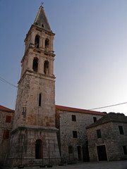 Fototapeta na wymiar Bell tower, St. Stephen's Square, in the historical centre of Stari Grad, Hvar island, Croatia