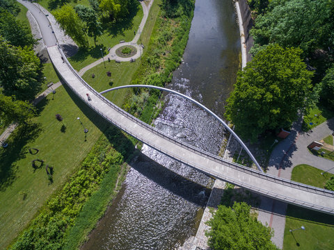 Aerial view of peasant bridge over river Olse between Cieszin and Czech Tesin. Border between Czech republic and Poland.