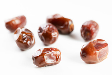 Close-Up Of Dates Over White Background