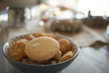 the cookie is in a Cup on the table. light from the window. close up