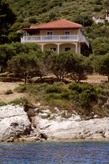 Fototapeta na wymiar House standing on the seashore, Blue caves on Zakynthos island