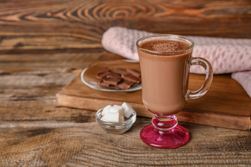 Cup of hot chocolate on wooden background