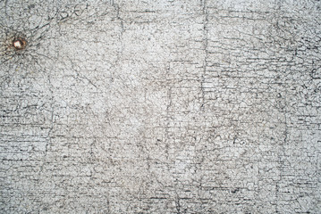Old, vintage white paint with cracks on the surface