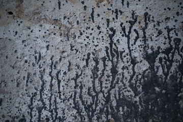 Old scratched light texture with sweats of black paint