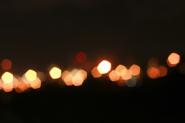 Red and orange Bokeh pentagon for background, glitter light Defocused and Blurred Bokeh, Colorful.