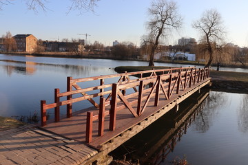 Fototapeta premium wooden lake pier in spring park