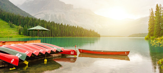 Canoes at Emerald lake near Golden in Yoho National park in the canadian Rocky Mountains, British...