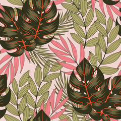 Original seamless tropical pattern with bright leaves and plants on a beige background. Exotic jungle wallpaper. Colorful stylish floral. Summer colorful hawaiian.
