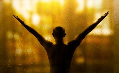 Fototapeta na wymiar portrait silhouette of confident man with orange bokeh nature light in hope concept background