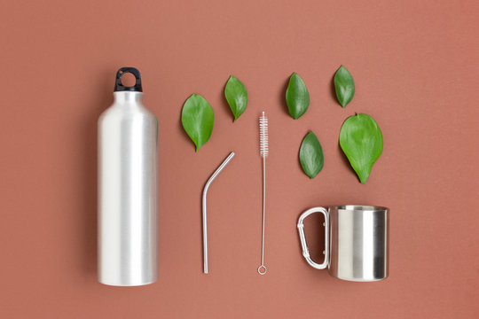 Zero waste accessories for drinking on a brown background. Plastic free concept.