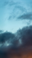 Obraz premium Fantastic clouds at sunrise, vertical panorama