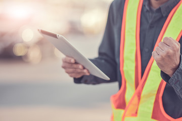 Foreman building construction hold tablet inspection work on site